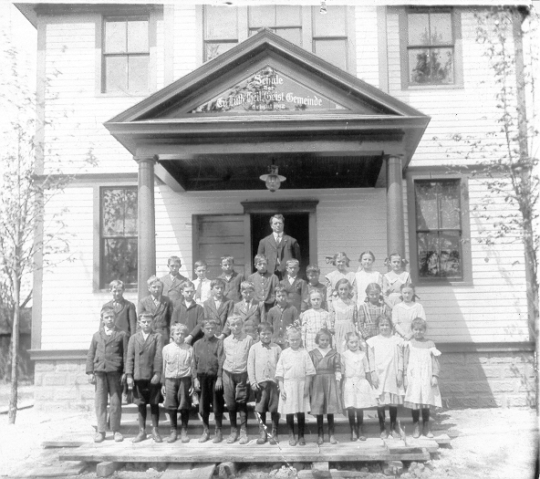 Alvin W.C. Starck in front of Holy Ghost School